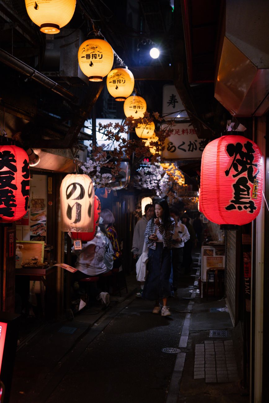 A lantern-lit alley in Tokyo at night